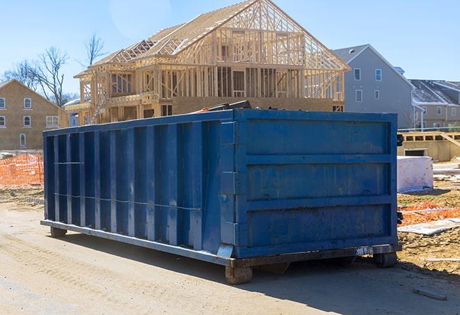 large waste bins sitting in a suburban driveway